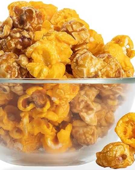 A clear bowl filled with gourmet popcorn that has a mix of cheese and caramel flavors.